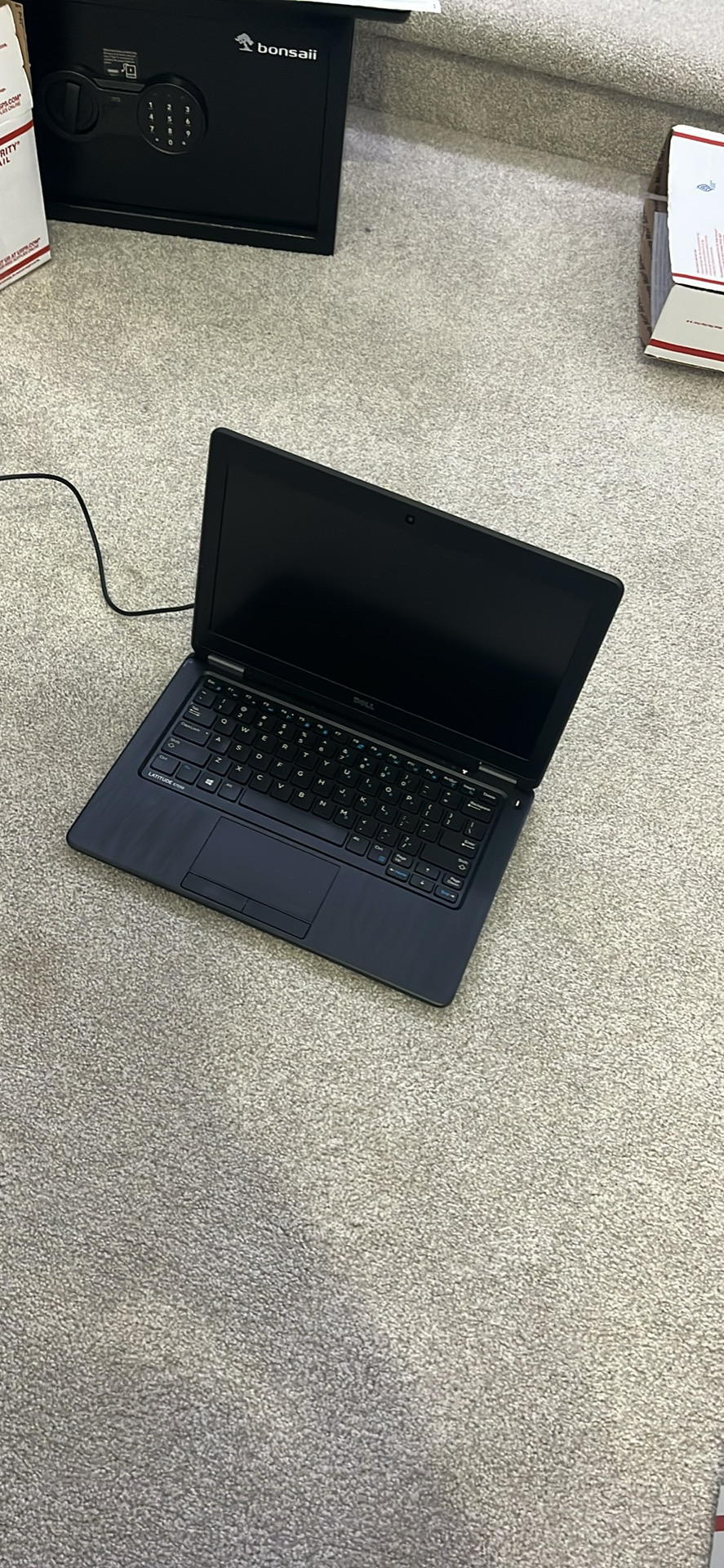 Laptop on the floor
